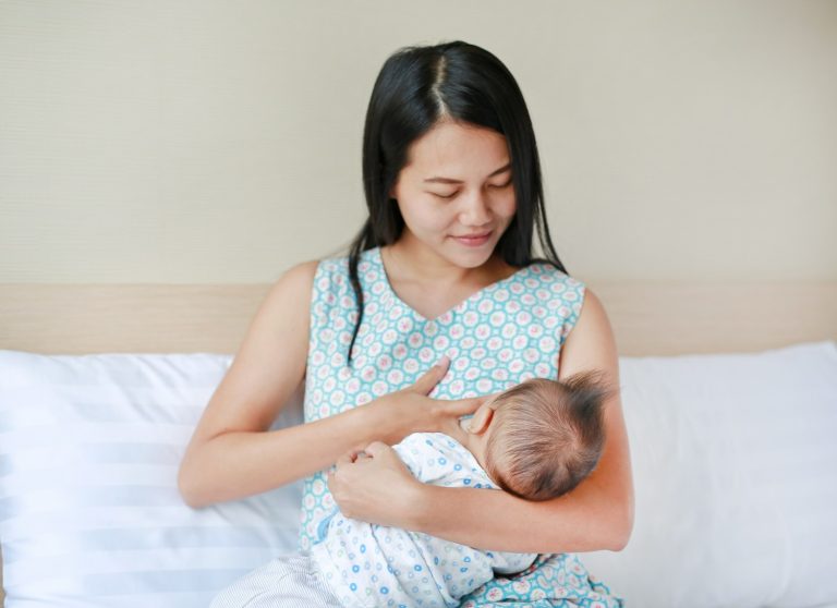 infant-baby-feeding-from-mother-breastfeeding-her-newborn-child-bed.jpg
